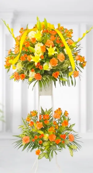 オレンジ色の2段の花のフラワースタンド